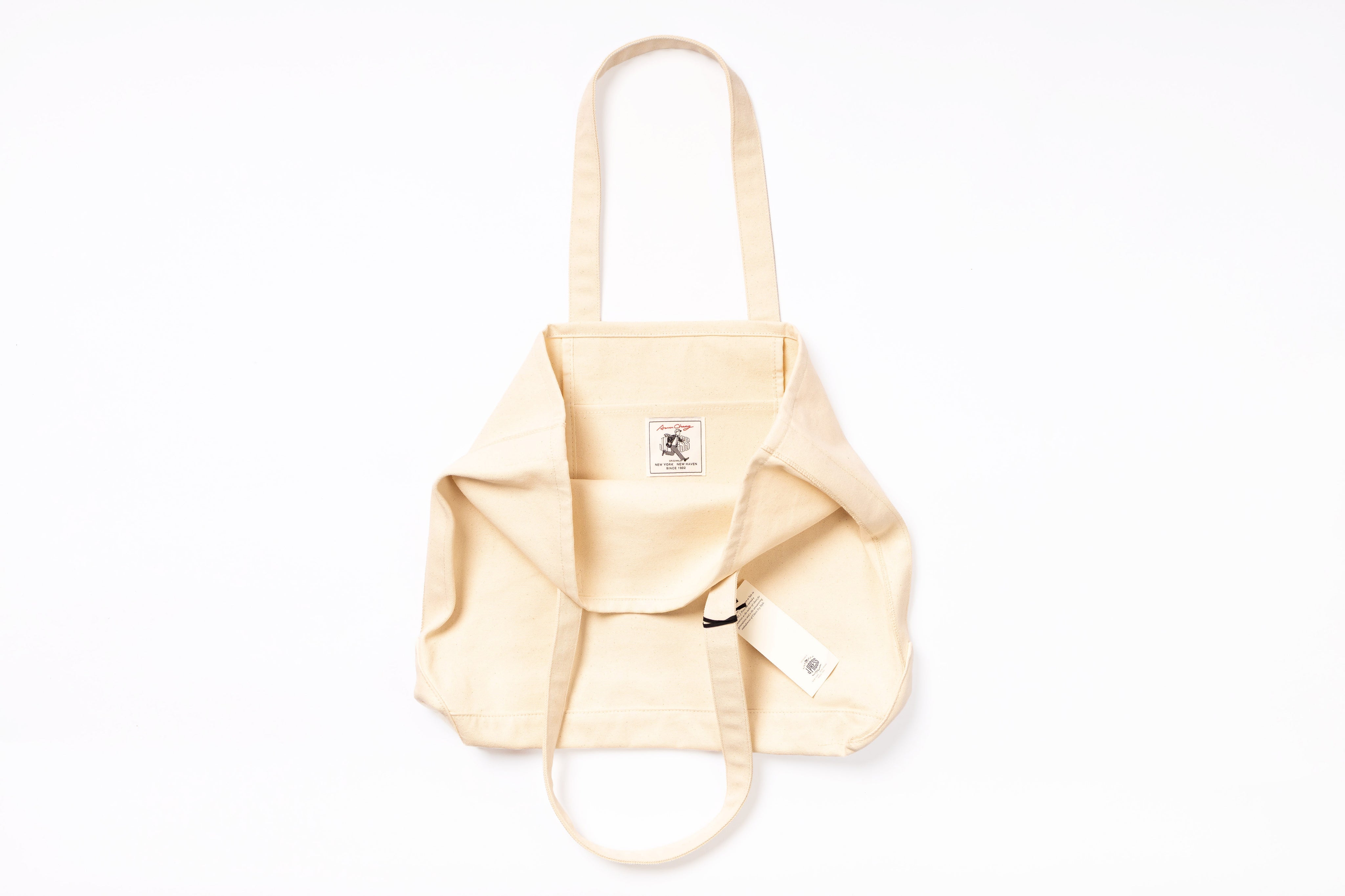 Beige backpack on a white background