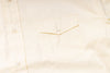 Close-up of a light-colored shirt with a pocket detail