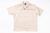 Beige short-sleeve shirt on a white background