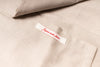Close-up of beige fabric with a label