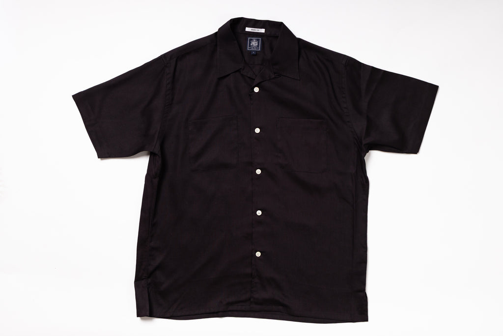 Black short-sleeve shirt on a white background