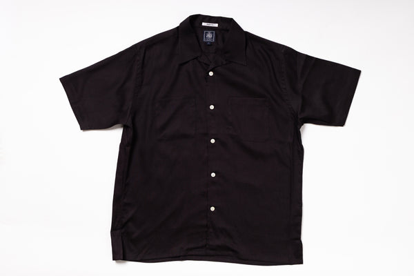 Black short-sleeve shirt on a white background