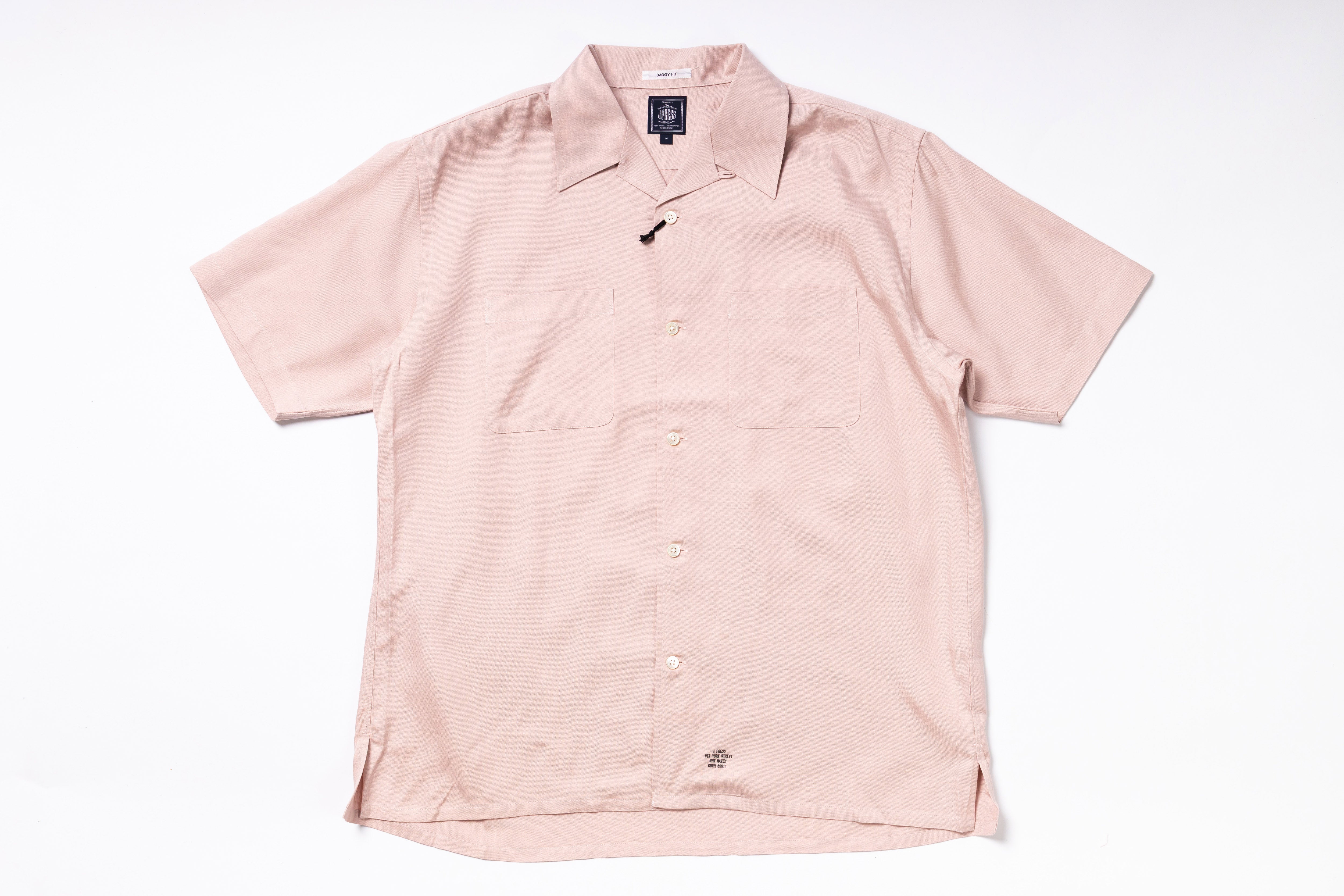 Pink short-sleeve shirt on a white background