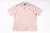 Pink short-sleeve shirt on a white background