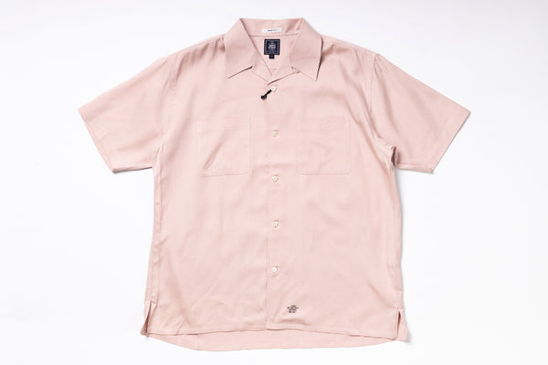Pink short-sleeve shirt on a white background
