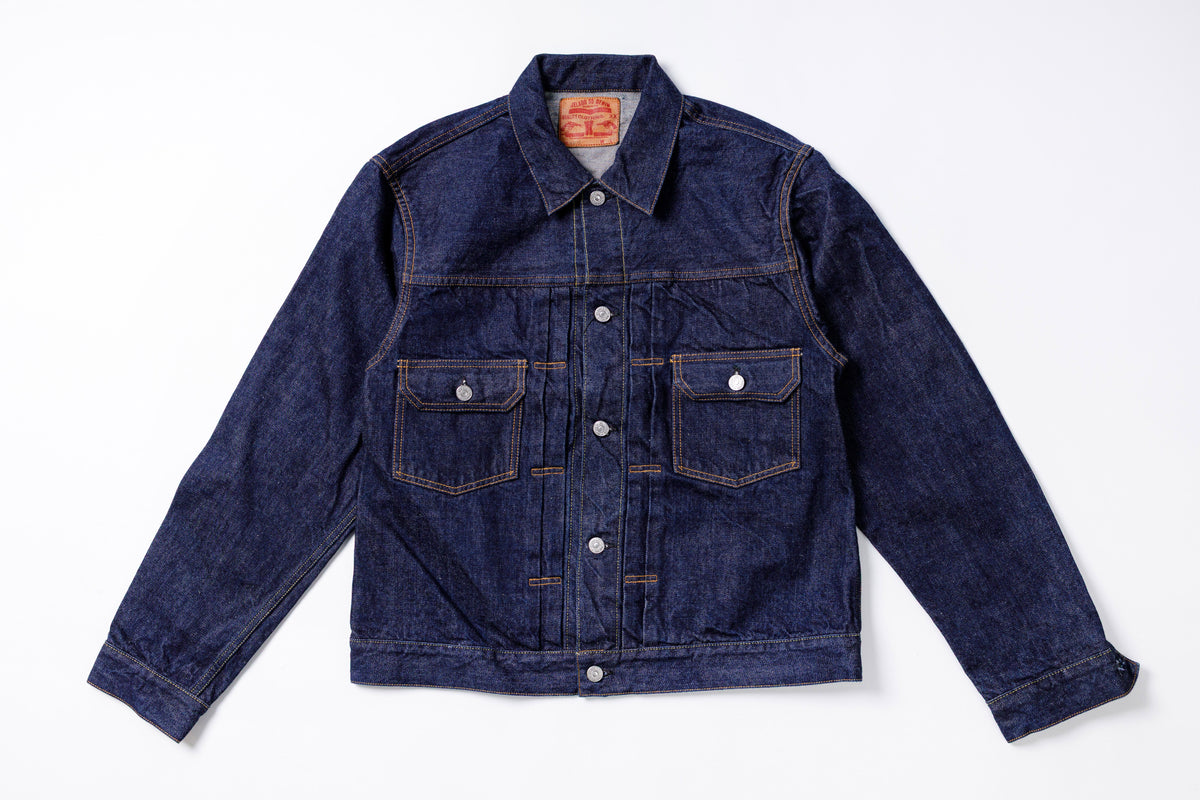 Blue denim jacket on a white background