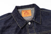 Close-up of a denim shirt collar with a brand label on a white background
