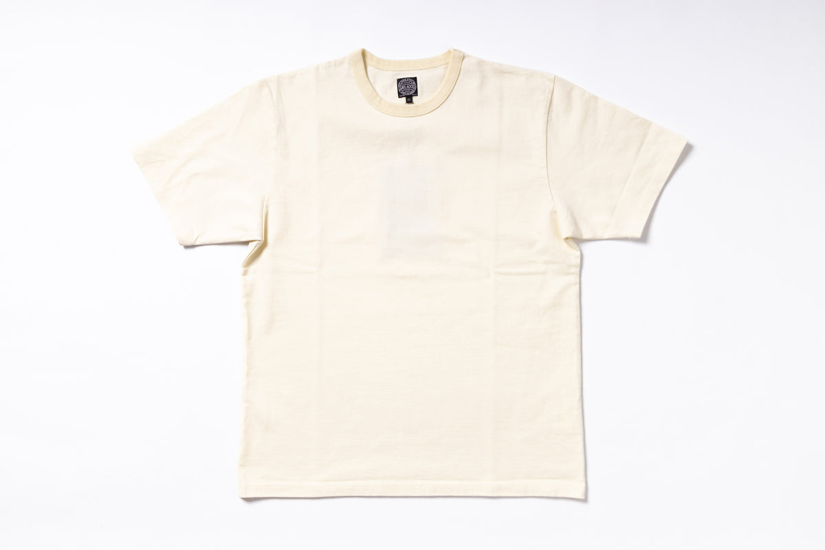 A cream-colored short-sleeve crewneck t-shirt laid flat against a clean white background.