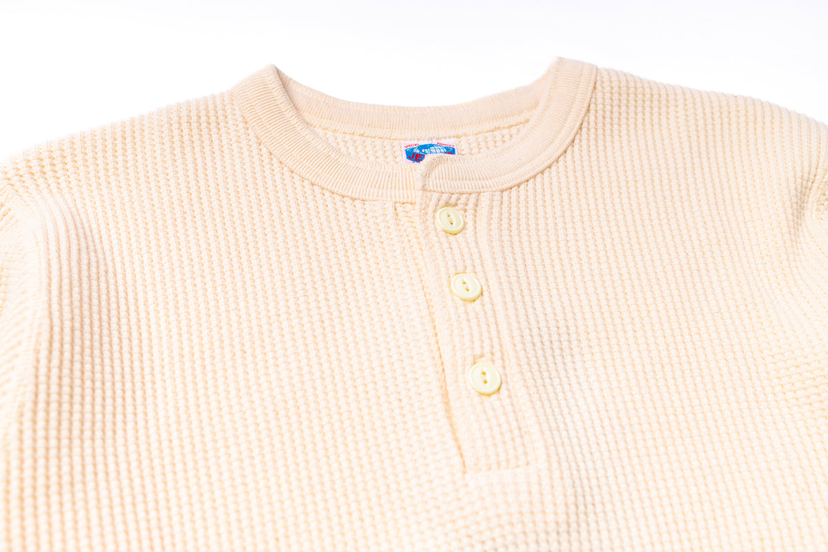 Beige textured shirt with buttons on a white background