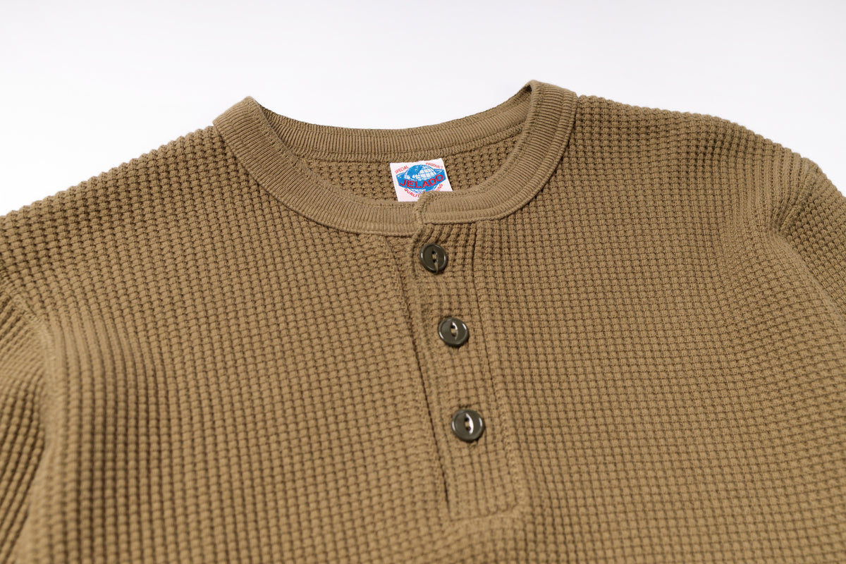 Brown textured shirt with buttons on a white background