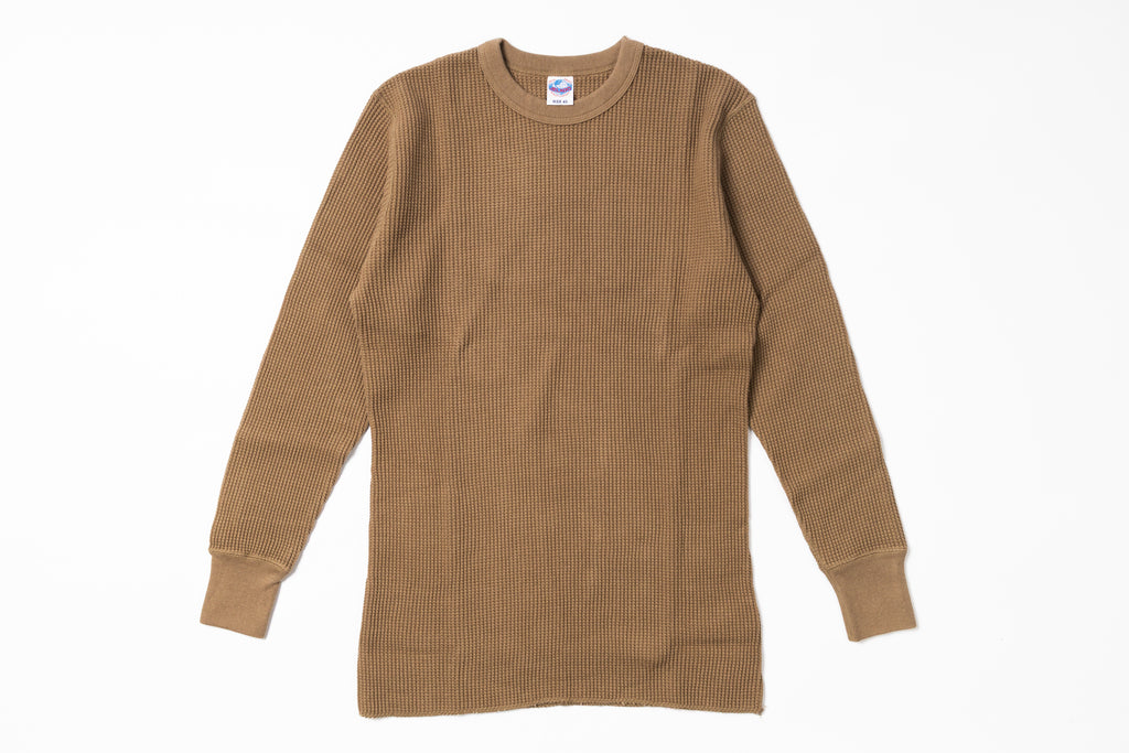 Brown ribbed sweater on a white background