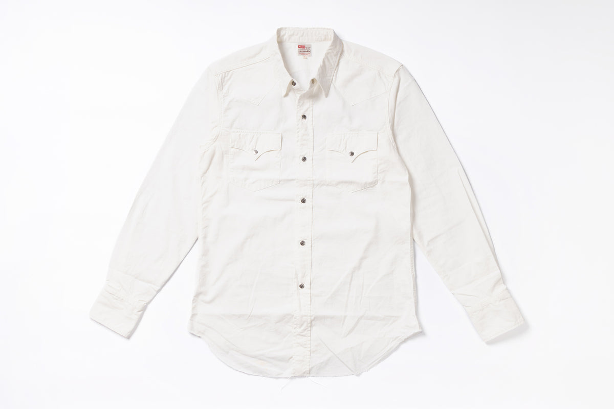 An off-white long-sleeve button-down shirt with two chest flap pockets, laid flat on a white background.