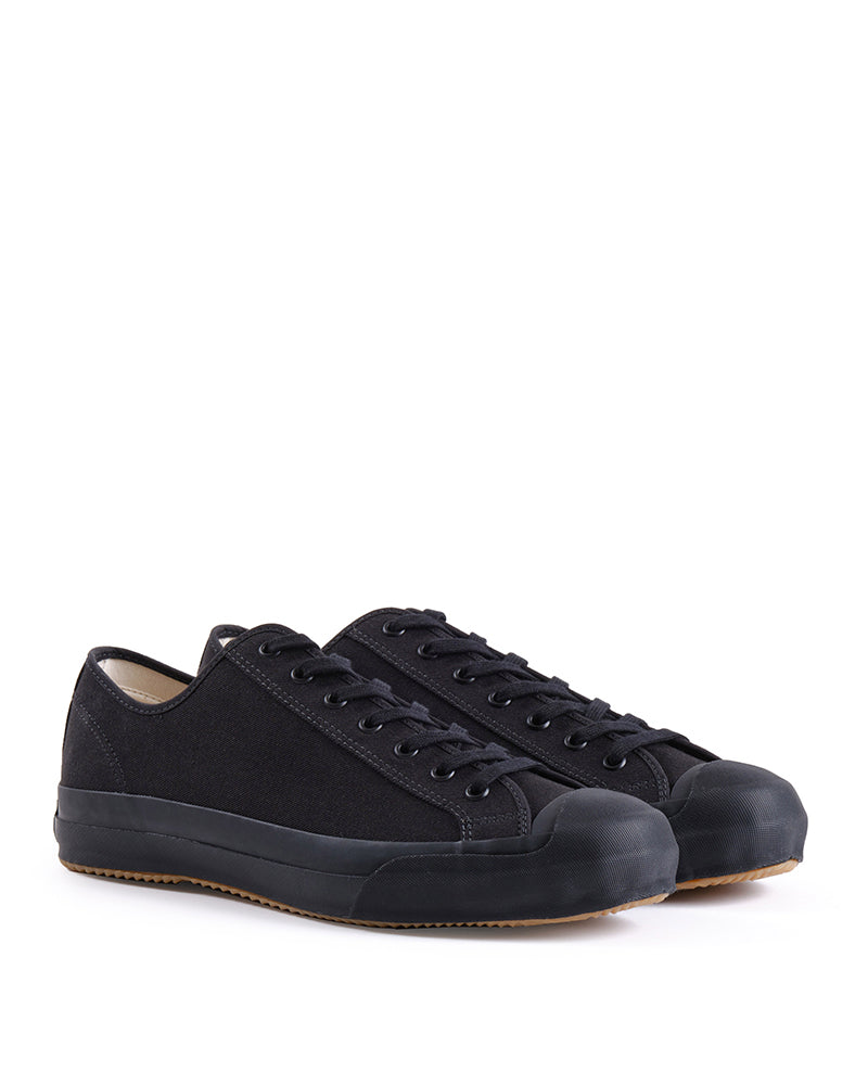 Pair of black sneakers on a white background