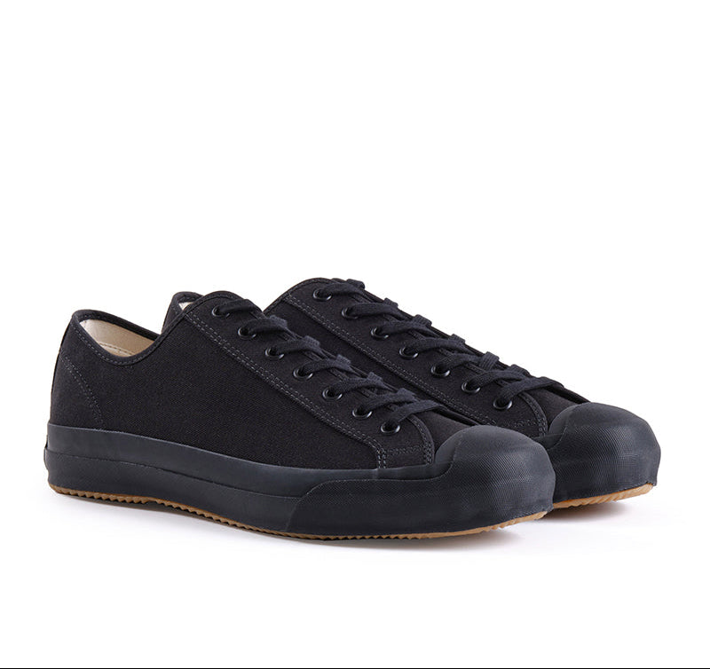 Pair of black sneakers on a white background