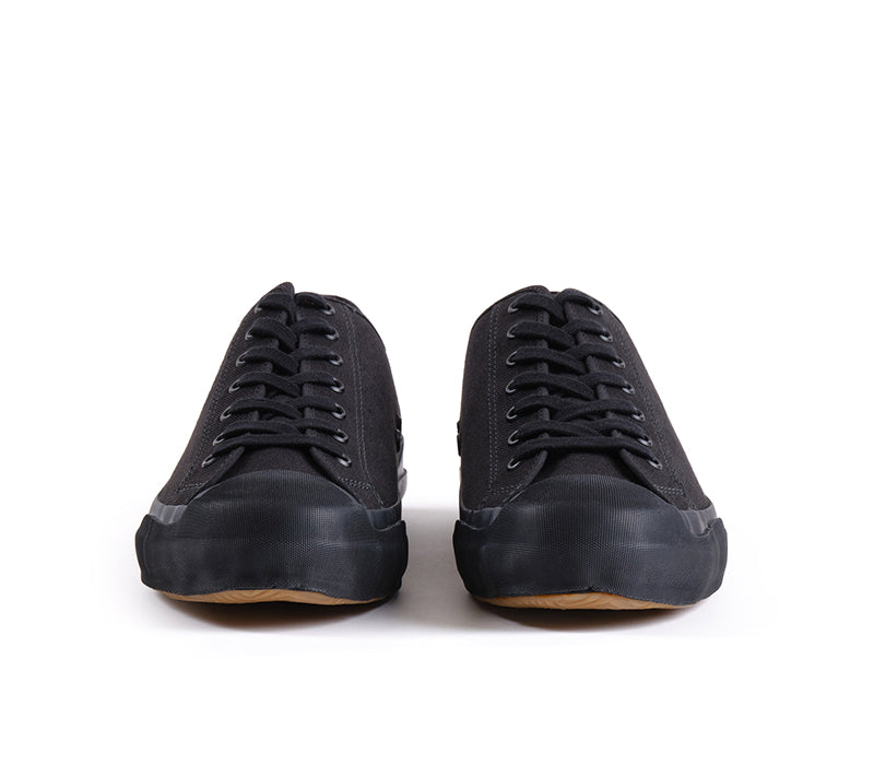 Pair of black sneakers on a white background