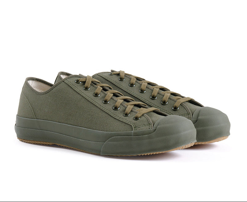 Pair of green sneakers on a white background