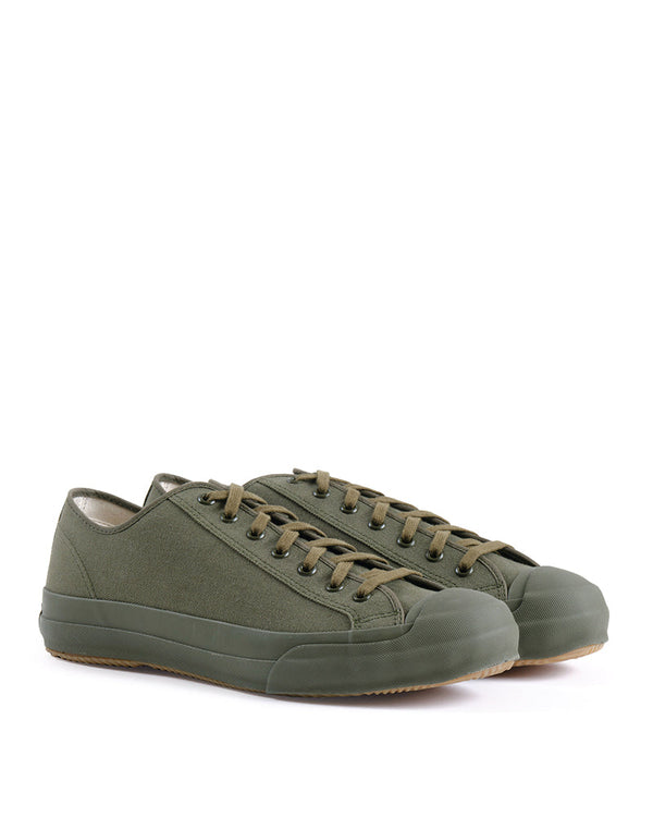 Pair of green sneakers on a white background