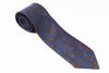 Blue paisley patterned tie on a white background