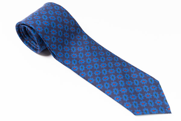 Blue patterned tie on a white background