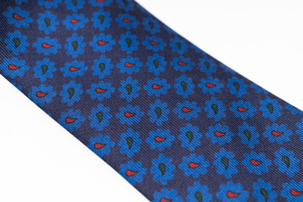 Navy blue tie with blue floral pattern on a white background