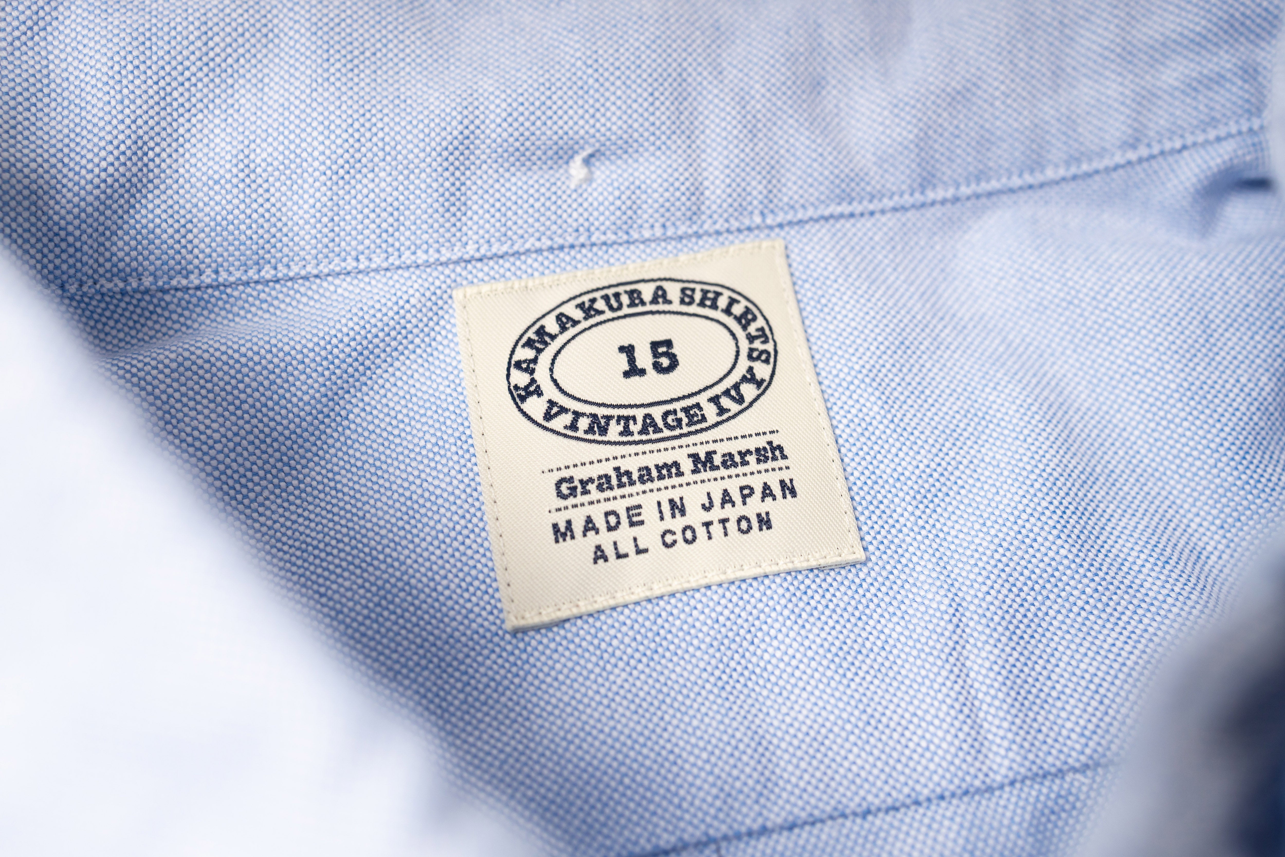 Close-up of a blue fabric with a label on a white background