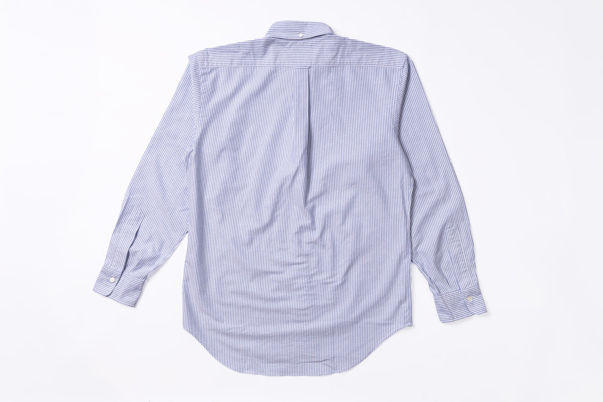 A light blue and white vertically striped long-sleeve button-down shirt, shown from the back, laid flat on a white background.