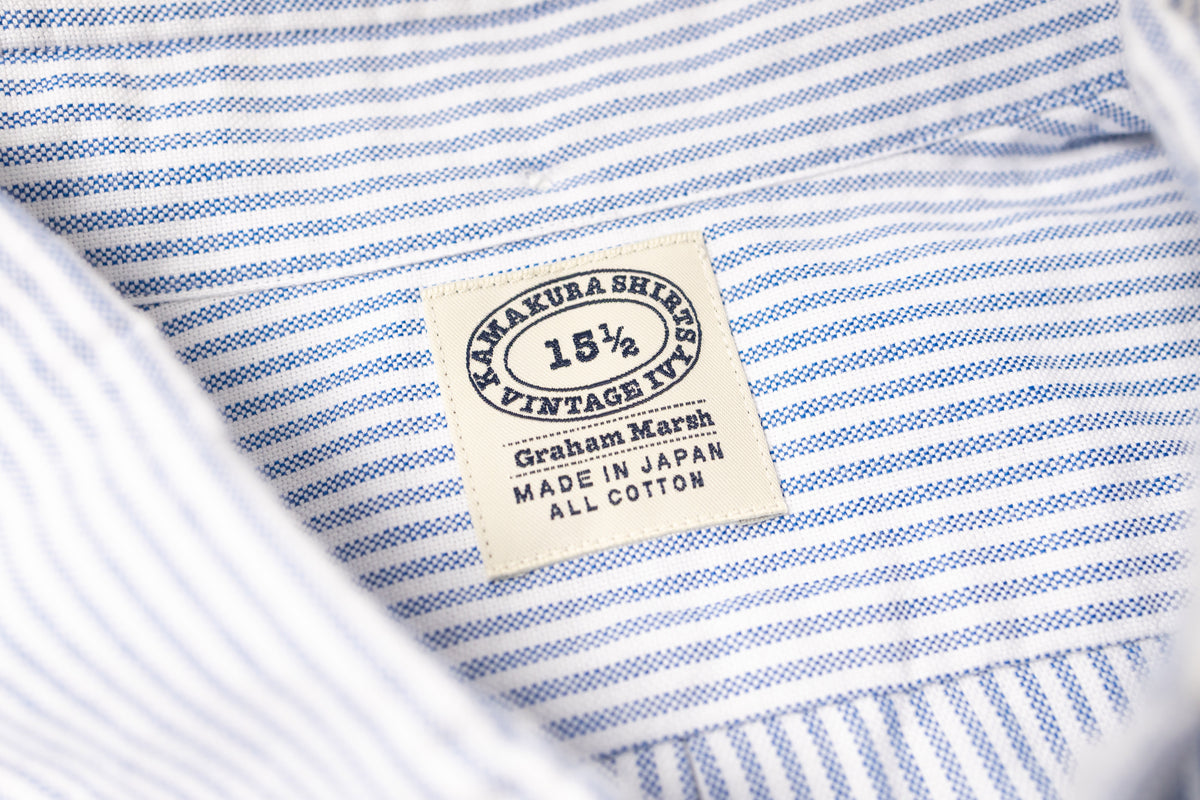 Close-up of a striped fabric with a label on a white background