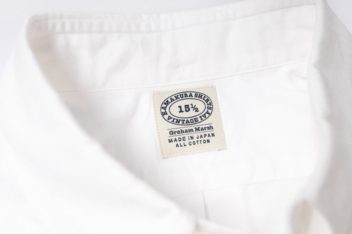 Close-up of a white fabric with a label on a white background