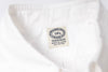 Close-up of a white fabric with a label on a white background