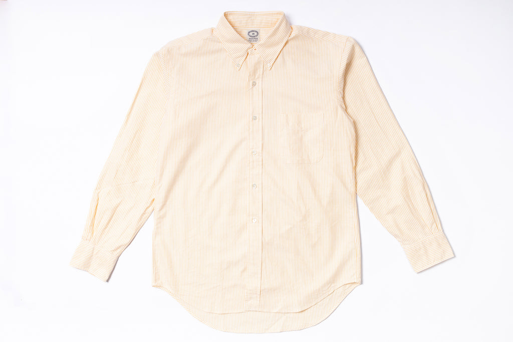 Oxford Shirt with yellow stripes on a white background
