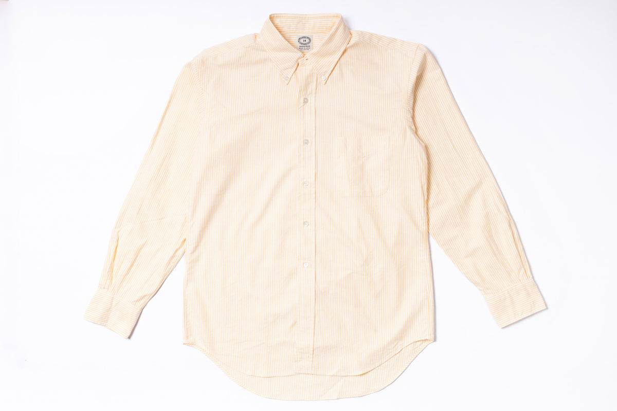 Oxford Shirt with yellow stripes on a white background
