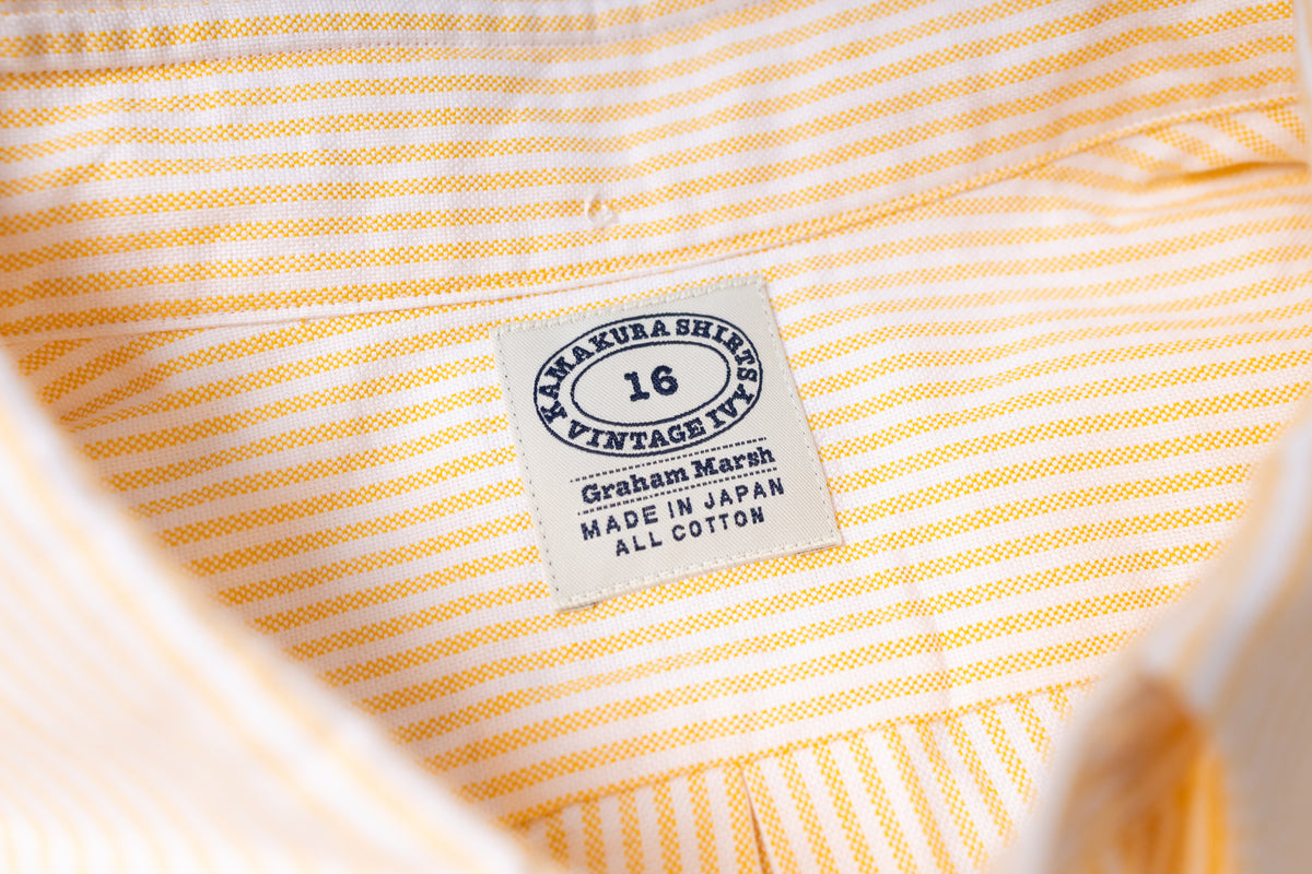 Close-up of a striped fabric with a label on a white background