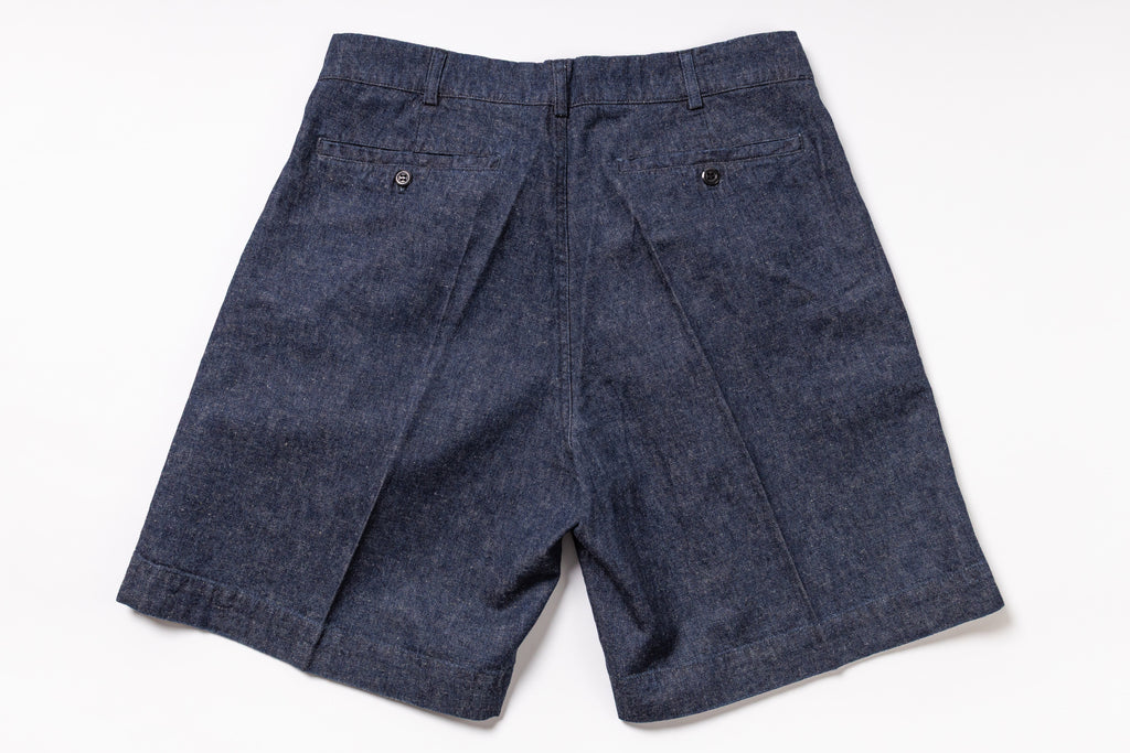 Blue denim shorts on a white background