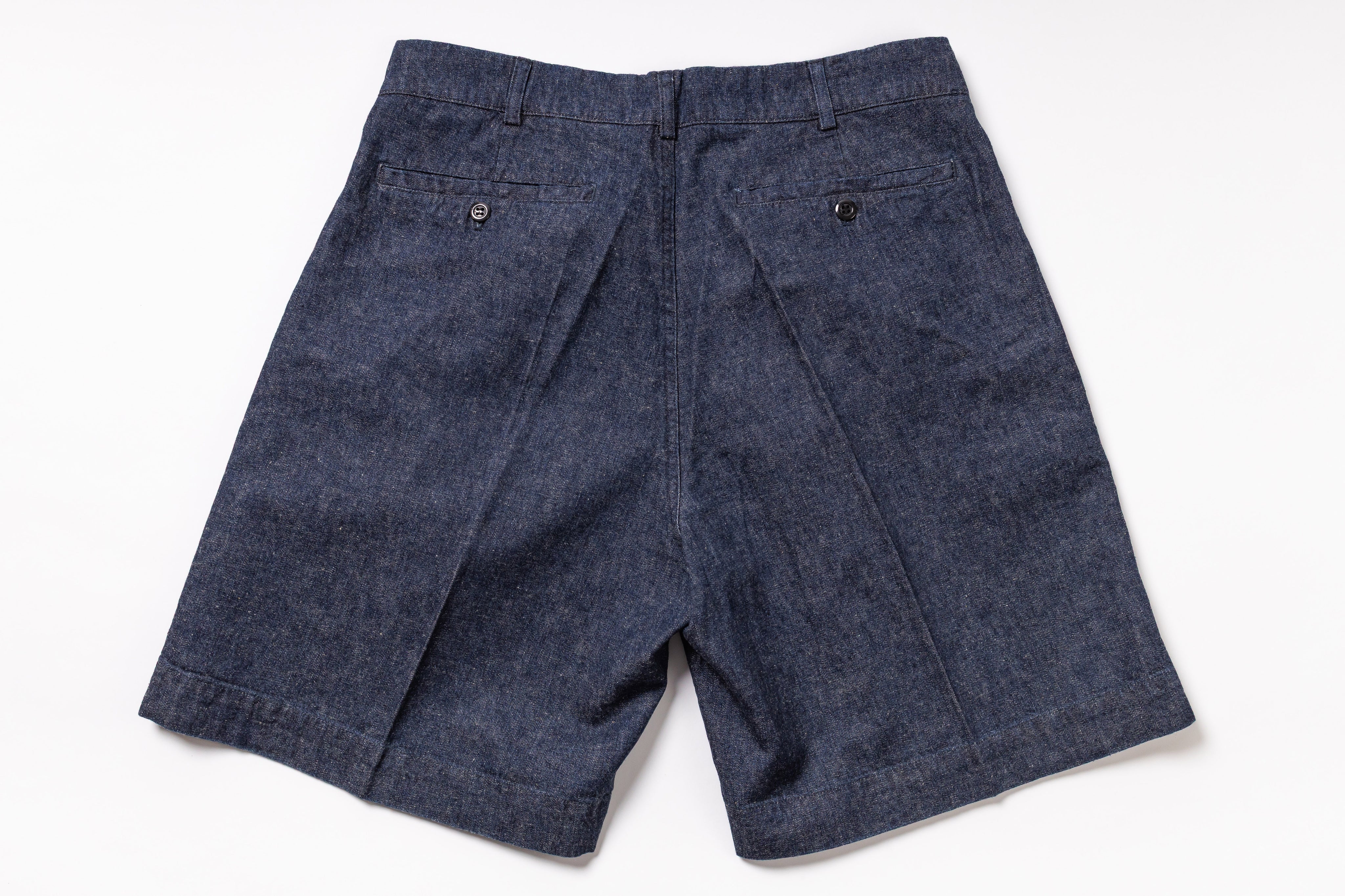 Blue denim shorts on a white background