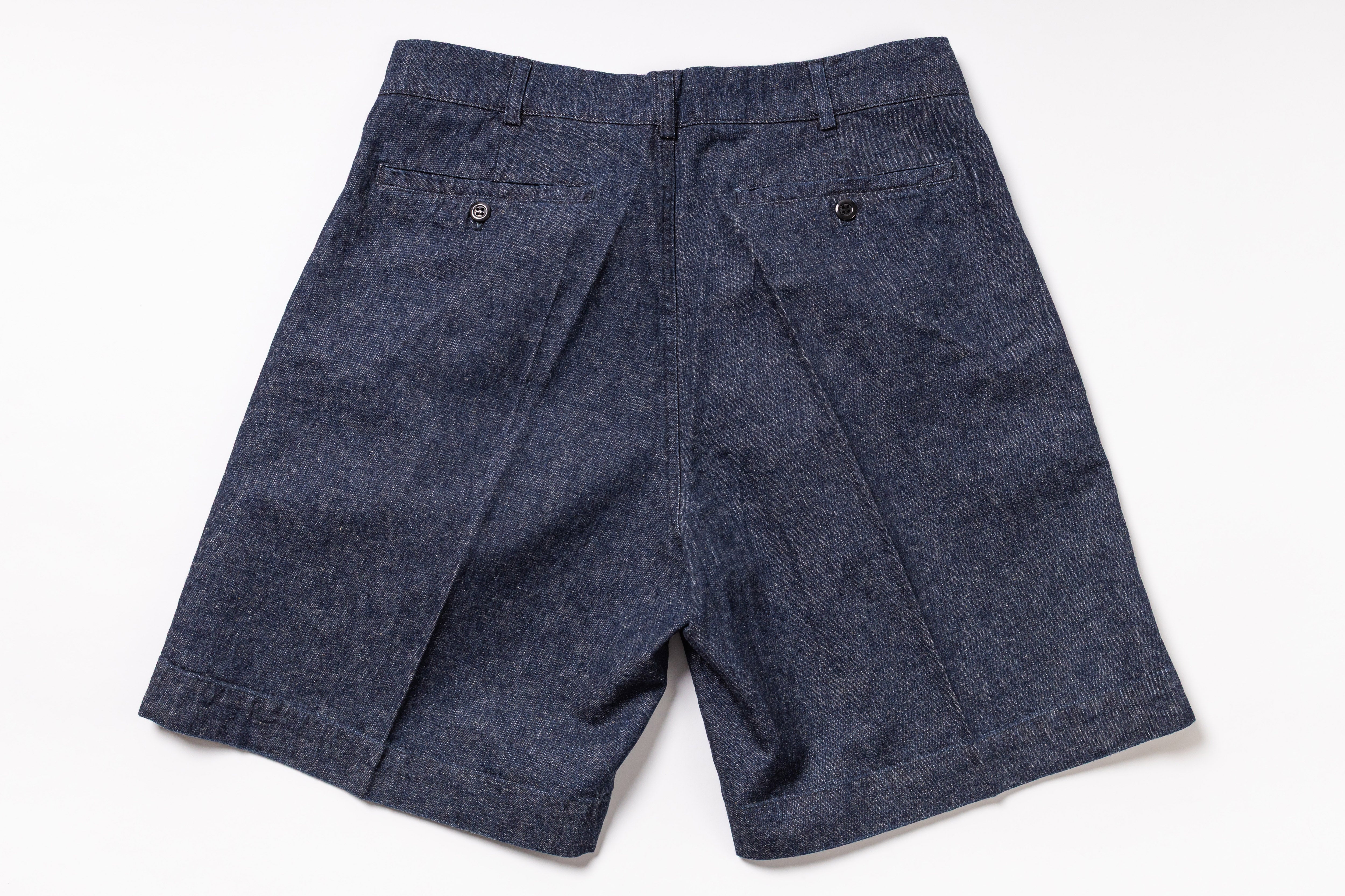 Blue denim shorts on a white background