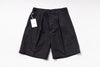 Black shorts with a tag on a white background