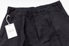 Black pants with a tag on a white background