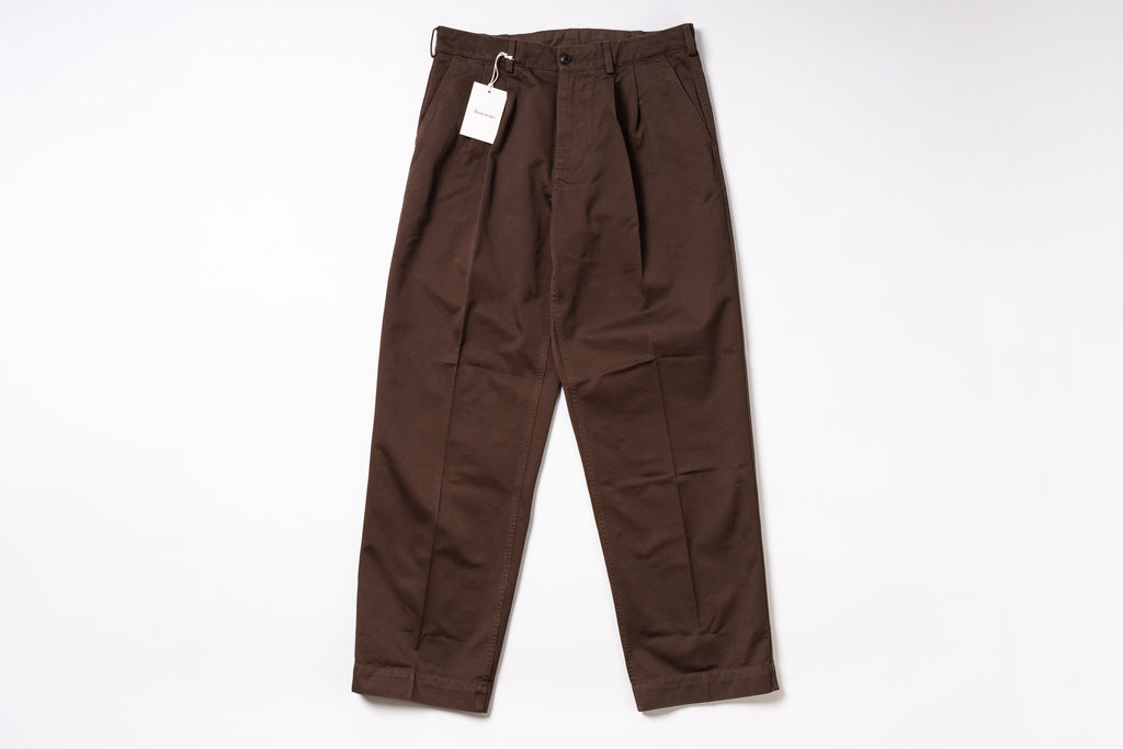 Brown pants with a tag on a white background