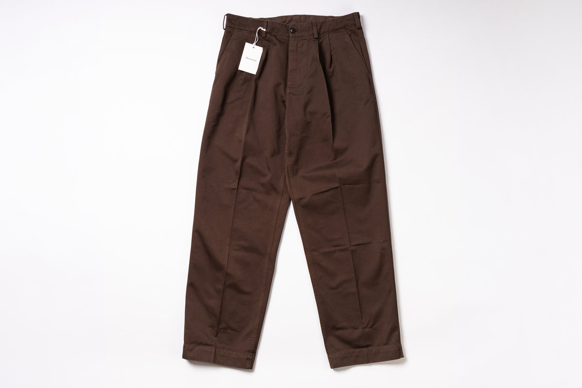 Brown pants with a tag on a white background