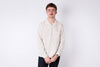 man wearing a white seersucker shirt on a white background 