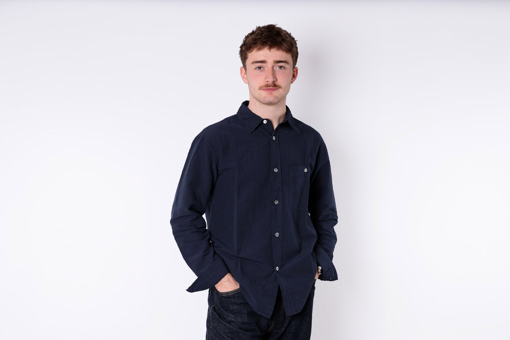 A man wearing a blue shirt