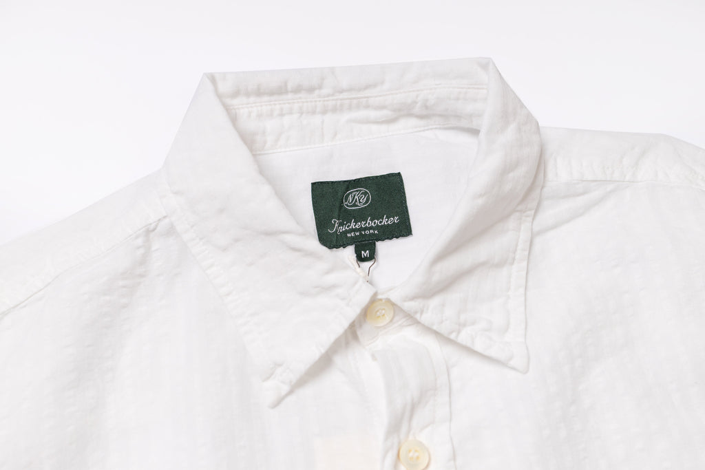 Collar of a white shirt on a white backfround