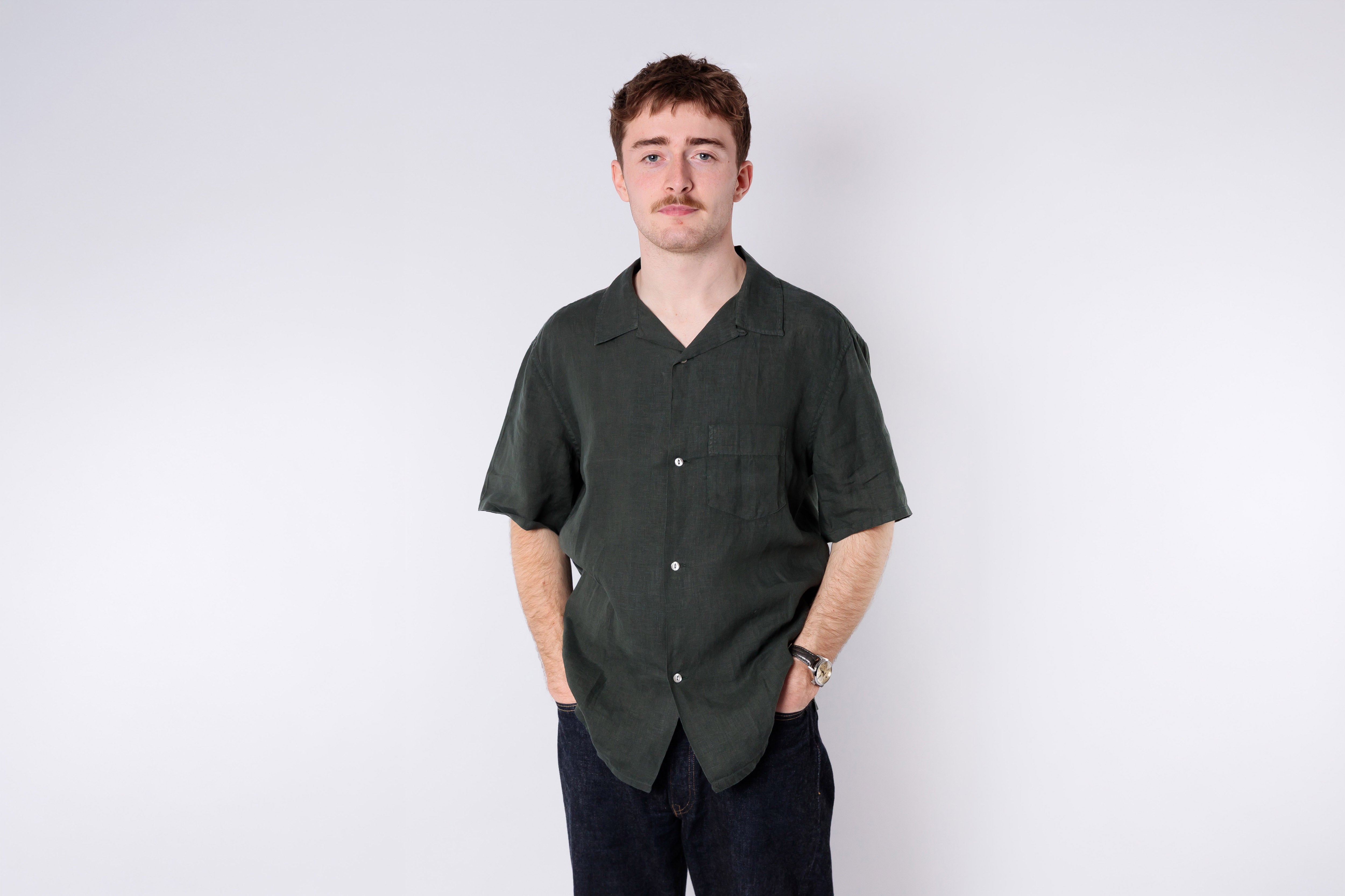 Man wearing a green linen shirt 