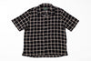 Black and white checkered shirt on a white background