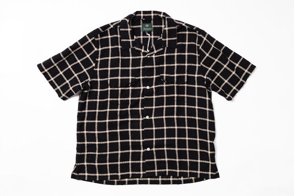 Black and white checkered shirt on a white background