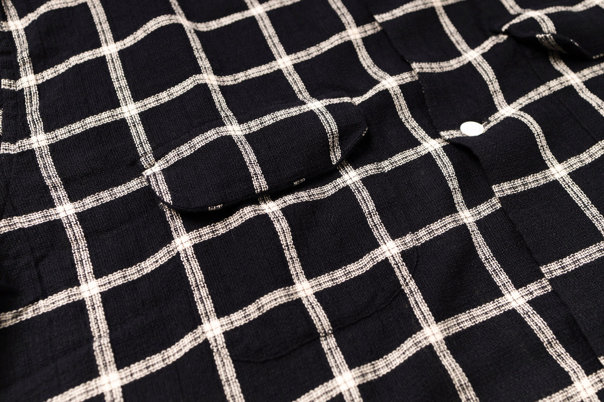 Close-up of a black and white checkered fabric texture