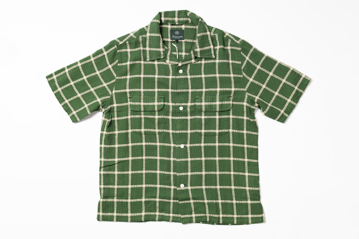 Green checkered shirt on a white background