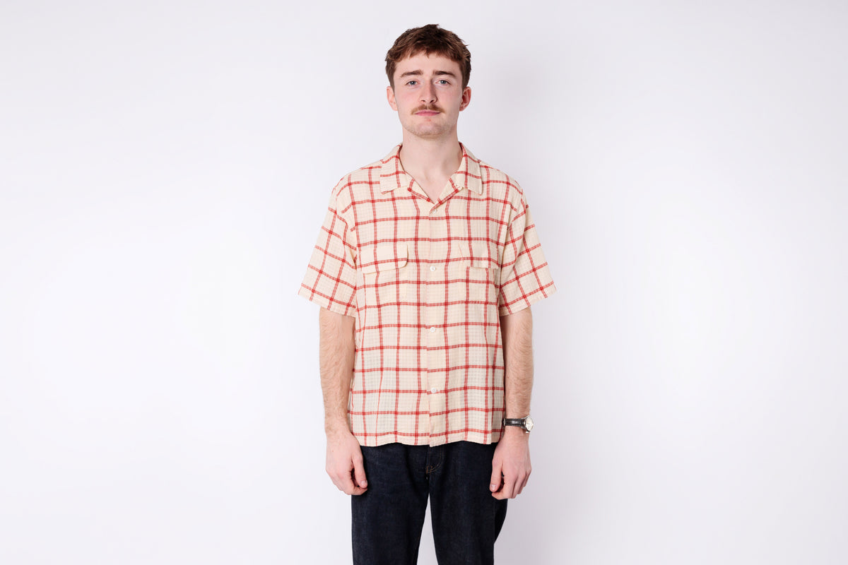 A man wearing a short sleeve shirt