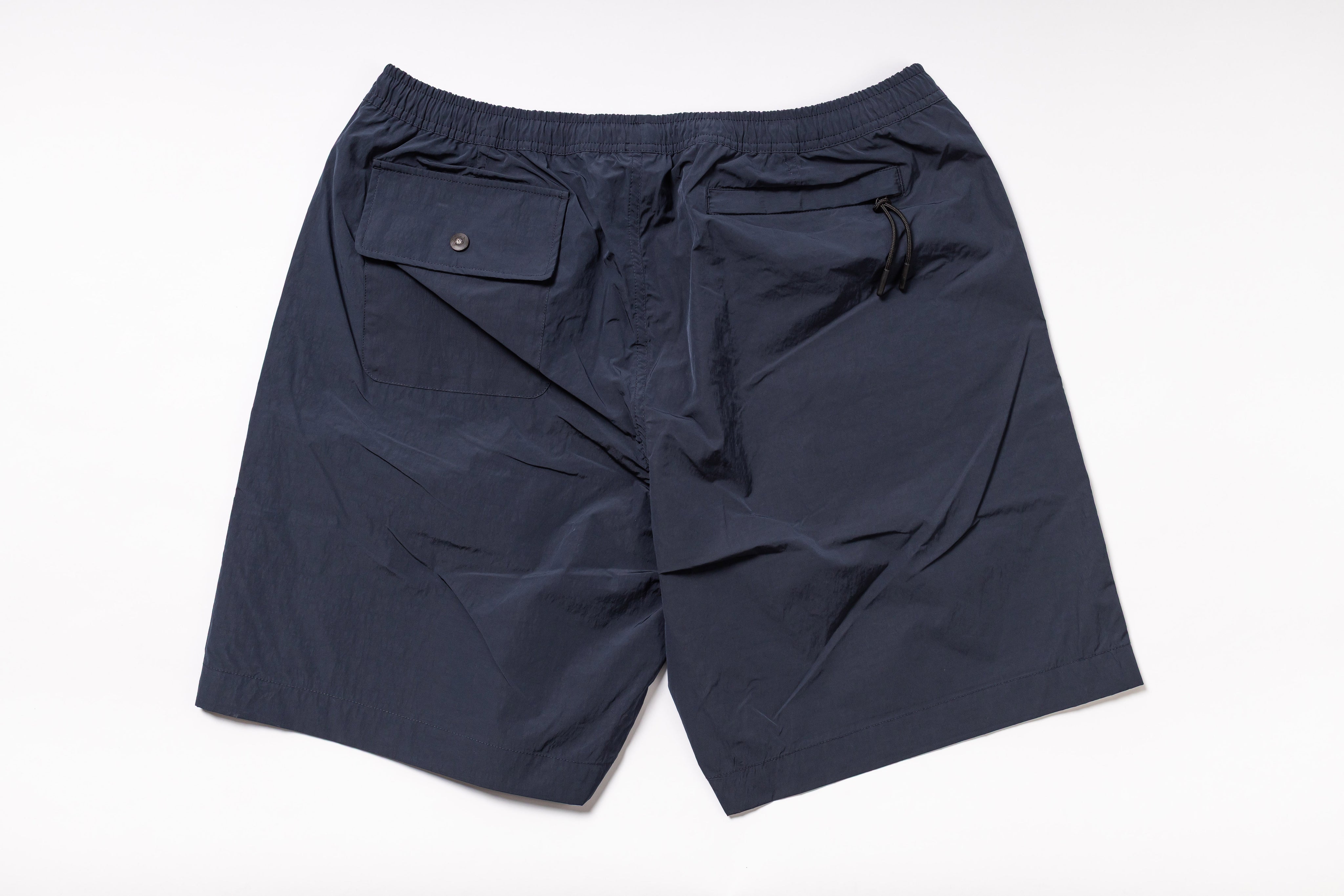 Navy blue shorts on a white background