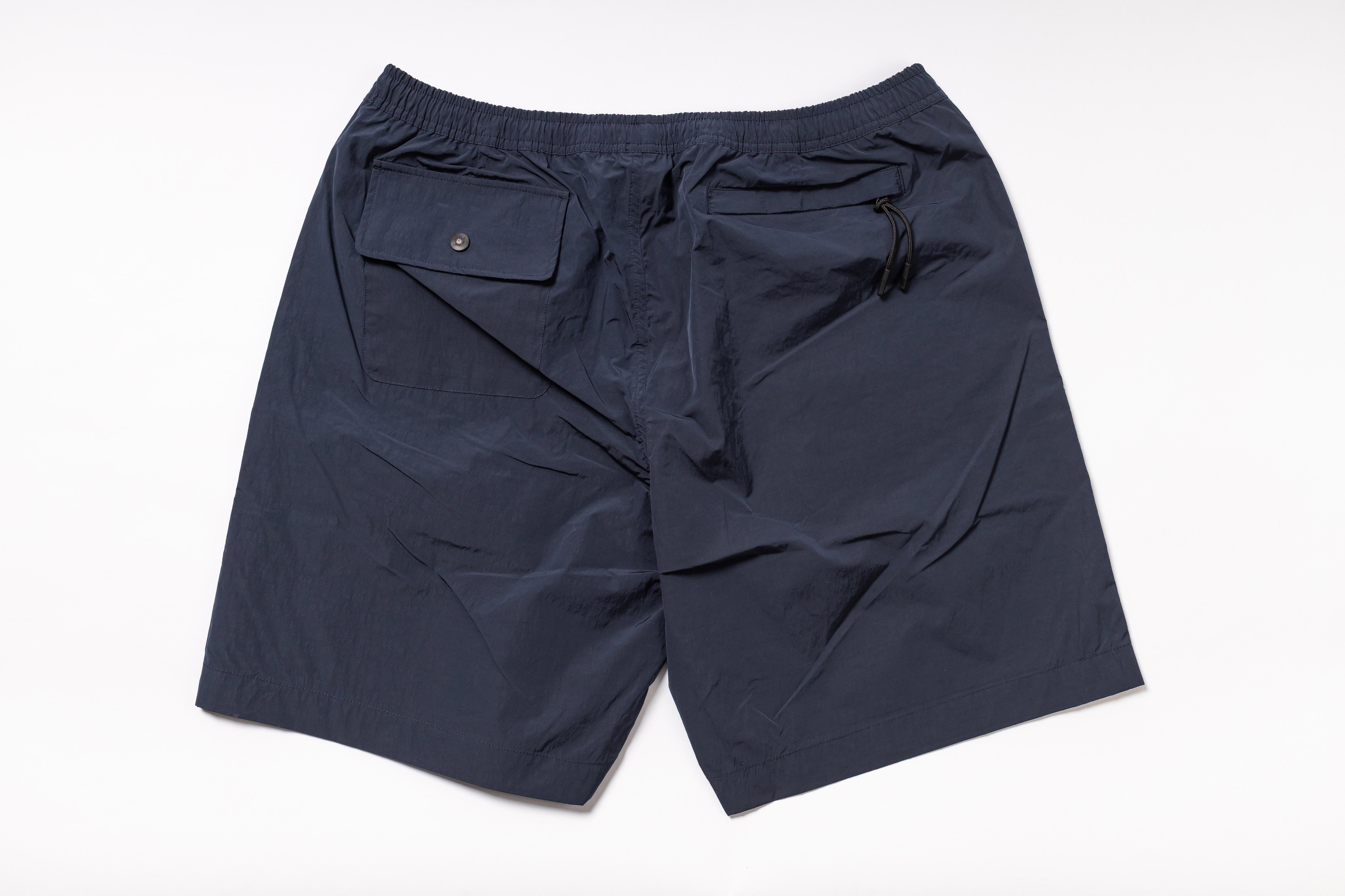 Navy blue shorts on a white background